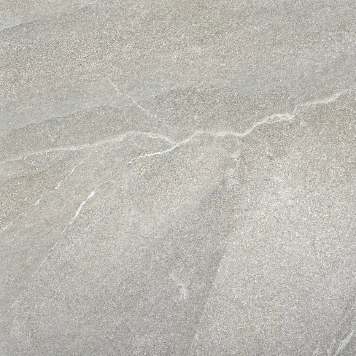 Close-up of gray stone tile with natural texture and cracks