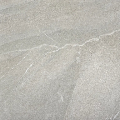 Close-up of gray stone tile with natural texture and cracks