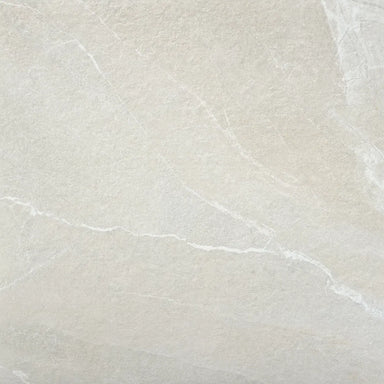 Close-up of a beige marble tile with subtle veining