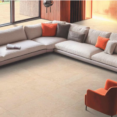 Modern sectional sofa with orange and gray cushions in a living room setting.