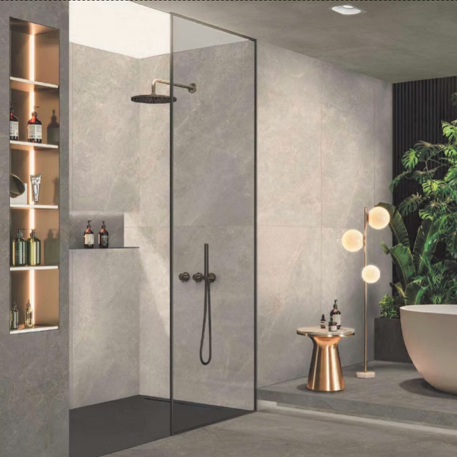 Modern bathroom with glass shower enclosure, bathtub, and decorative elements.