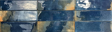 A gloss blue and gold wall tile. Tile display. 